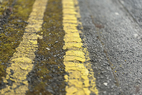 Double yellow lines in poor condition