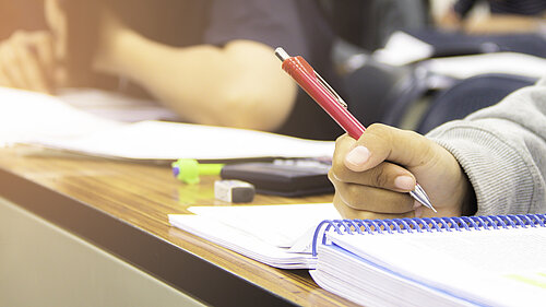Close up of students doing school work