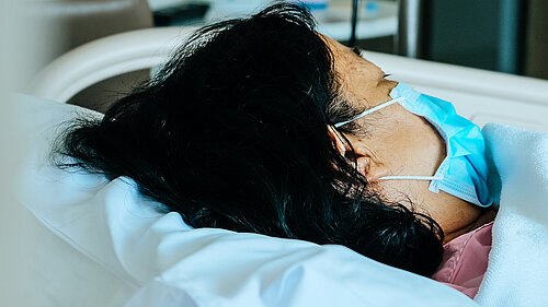 A patient in a hospital bed