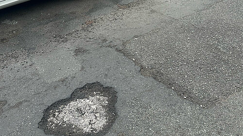 Just one of the many potholes on Oldham's streets